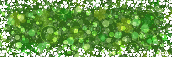 St.Patrick's Day green vector background with clover leaves and light effects	