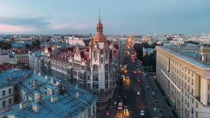 Obraz premium Aerial view on gothic building with red roof in Saint Petersburg. St Petersburg most famous city in Russia. View from above. Drone photo concept. Art Nouveau architecture. Street perspective.