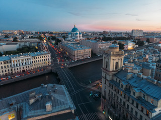 Aerial view on Trinity Cathedral, Fontanka river and house with decorative tower in Saint Petersburg. Evening light, pink sunset. View from above. St Petersburg is most famous city in Russia.