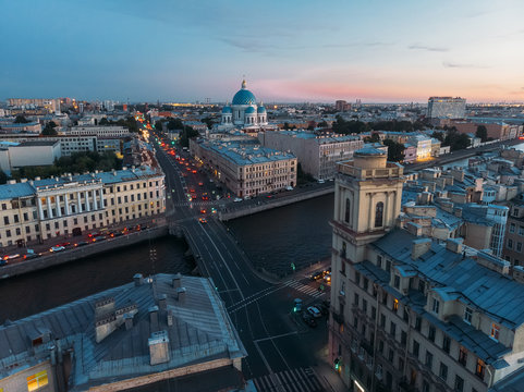 Aerial view on Trinity Cathedral, Fontanka river and house with decorative tower in Saint Petersburg. Evening light, pink sunset. View from above. St Petersburg is most famous city in Russia.