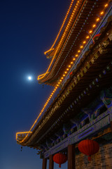 Fototapeta na wymiar Ancient Chinese building in the moonlight