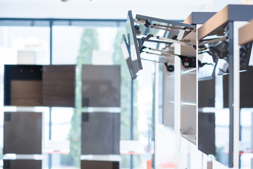 Kitchen cabinet with opened fronts with dish holder shelves inside. Lift system for bi-fold fronts for direct access in kitchen cabinets.