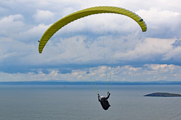 Paraglider flying above Rhossili	