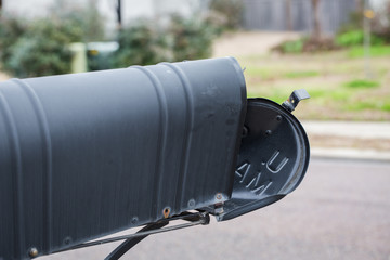 Mailbox that has been hit and damaged by car