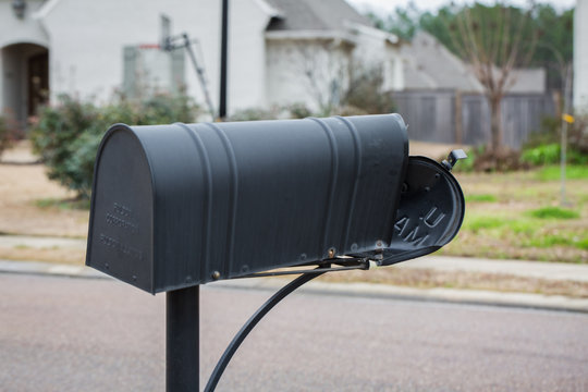 Mailbox That Has Been Hit And Damaged By Car