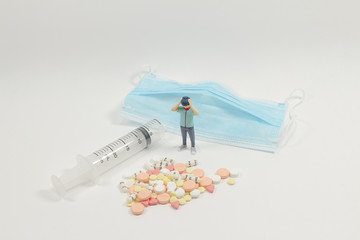 a scale figure is standing in front of the pill