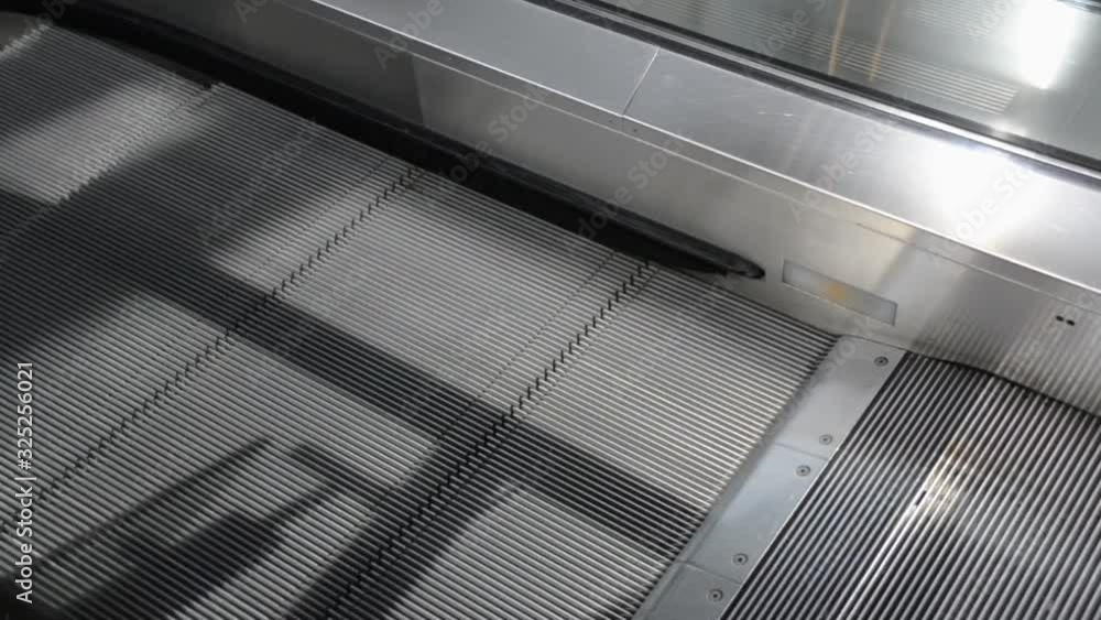 Canvas Prints pov to flatted escalator while working with sun shine on it. technology moving escalator. moving pat