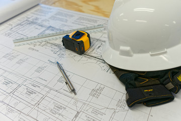 Construction drawings with hardhat