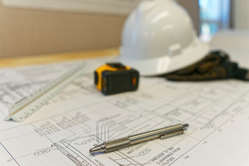 Construction drawings with hardhat