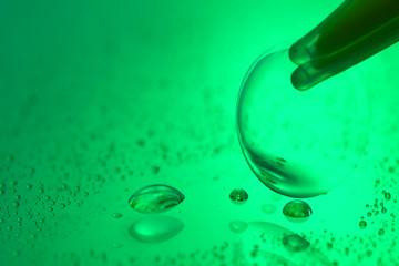 Tweezers with contact lens on color background, closeup