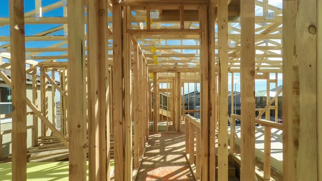 Moving through the interior of an unfinished American home in mid construction phase