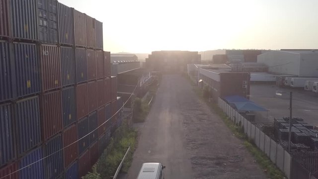Flying between containers, into the sun. Early monring, shot in magic hour.