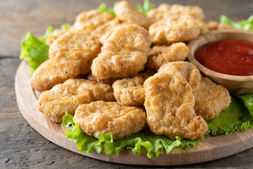 Fried crispy chicken nuggets with ketchup close-up