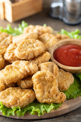 Fried crispy chicken nuggets with ketchup close-up