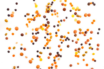 Different types of lentils isolated on a white background.