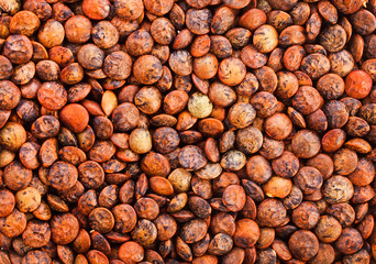 Background of raw brown lentils. Top view.