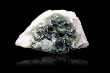 Mineral quartz cats eye on a black background