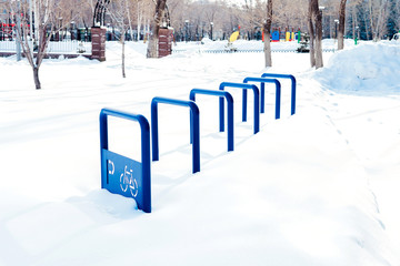 Blue metal structure for Parking bicycles or scooters, environmental transport in the city. Moving...