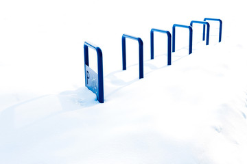 Blue metal structure for Parking bicycles or scooters, environmental transport in the city. Moving...