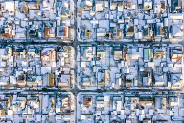 aerial top view of snow covered roofs in residential area in city of Minsk, Belarus
