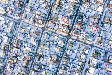 aerial view of a residential neighborhood on a sunny winter day. architectural background