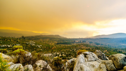Smoke covering the Sierra Nevada Mountains and the Merced River Valley due to the 2019 Briceburg Fire, a large Forest Fire outside Yosemite National Park in California, United States