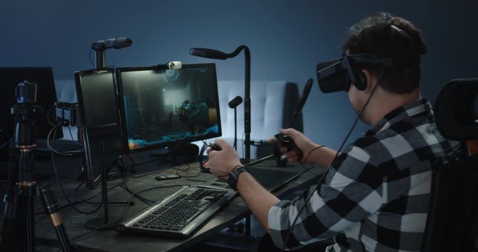 Developer playing a VR game or simulator