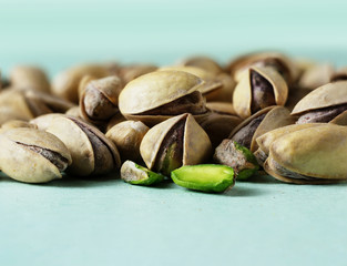 Organic food. Pistachio nuts on a light background. Macro. Concept of vegetarian food. Healthy food.