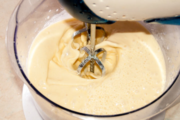 Preparing the dough for mixing with a mixer. Dough for pancakes