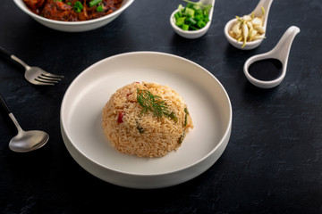  Vegetarian fried rice with manchurian served in a plate