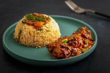 Vegetarian fried rice with manchurian served in a plate