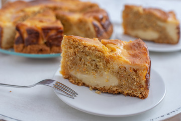 home made carrot cake cheesecake on a table