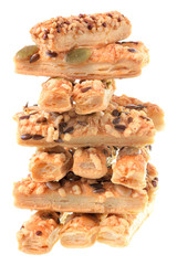 Mini seeded straws topped with cheese and seeds isolated