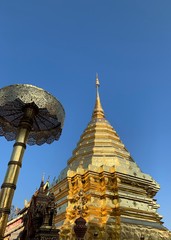 Fototapeta premium Golden pagoda with clear blue sky at Doi Suthep temple in Chiang Mai, Thailand