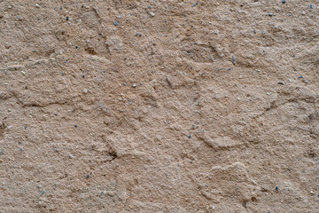 Background with dry, clay soil with small stones