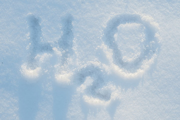 Fototapeta premium H2O water formula carelessly written in snow