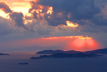Naklejka na ściany i meble Sunset , sunset on the islands of the Aegean, Greece, SporadesGreece , Mediterranean Sea , Aegean sea , Skiathos island ,Skopelos island vacation in Greece .