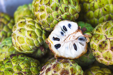 Exotic, Tropical fruits on the market, custard apples or sweet berries, Annona Reticulata fruits in...