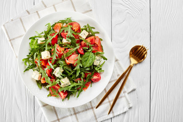 close-up of delicious healthy salmon arugula salad
