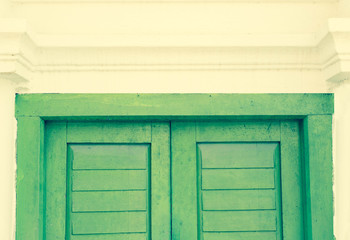 Green door  wooden  on white house building