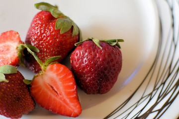 a serving   of Gourmet Strawberries, beautiful strawberries, with wonderful taste and sweetness, from the Greek field . organic .