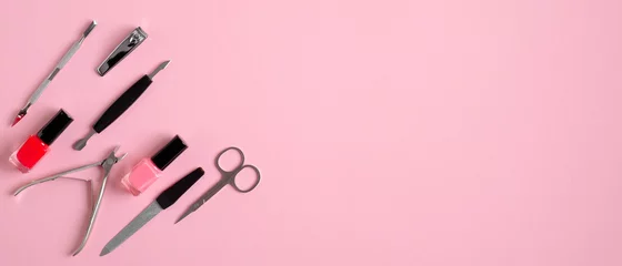 Foto auf Alu-Dibond Top view of manicure and pedicure equipment on pink background. Nail salon banner design template. Beauty treatment concept © photoguns