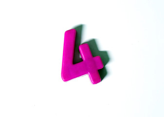 The number 4 is isolated on a white background with a shadow. Figure 4 made of plastic. Template. Number. Count. Children.