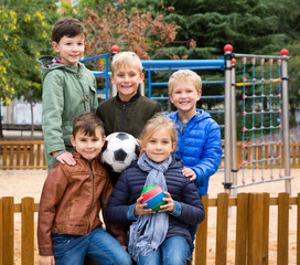 Group portrait of children with soccer ball in the park