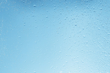 wet glass background condensate / abstract rain, drops texture on transparent glass