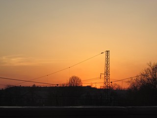 Fototapeta na wymiar electricity pylons at sunset