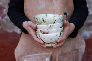Beautiful  ceramic tableware in men's hands