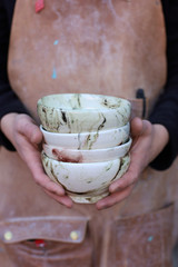 beautiful ceramic bowls in men 's hands