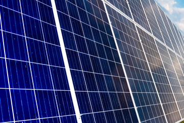 Solar panels produce energy from the sun with blue sky. Renewable energy.