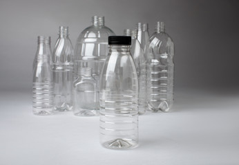 Many different transparent plastic new bottles